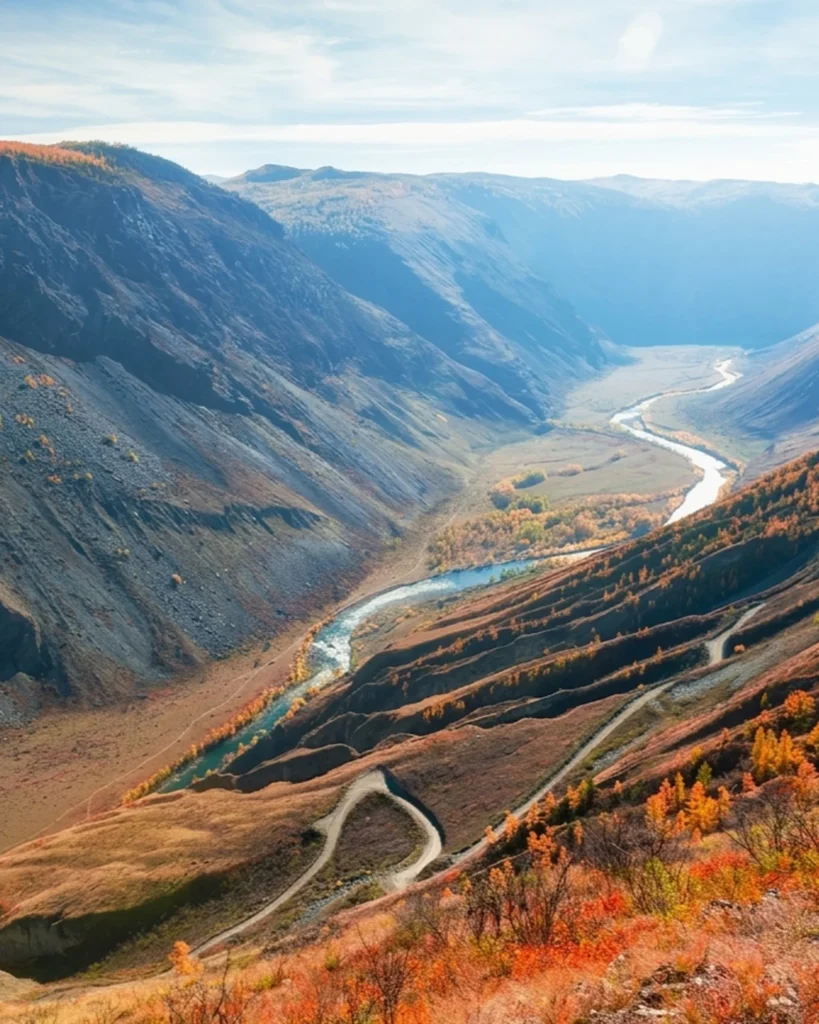 Mountain serpentine road descending into a river valley in the Altai biosphere